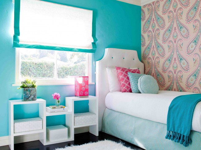 Pink paisley wallpaper compliments the light blue walls and adds an element of sophistication to this tween girl's bedroom.